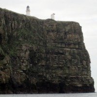 Dunnet Head Lighthouse - view looking up from the sea. 2013. Note only one foghorn.